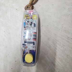 Transparent Wired Telephone with Yellow Dial